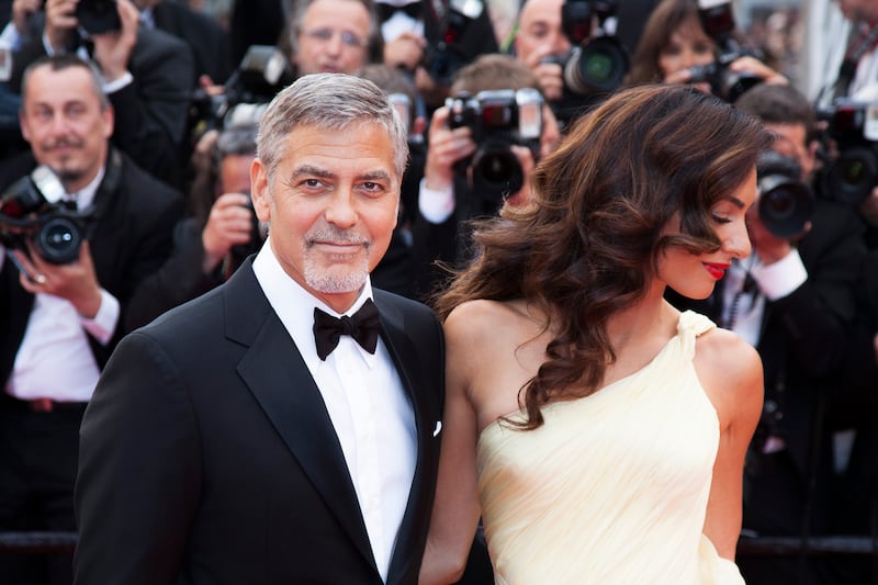CANNES, FRANCE - MAY 12: George Clooney and his wife Amal Clooney attend the 'Money Monster' premiere during the 69th annual Cannes Film Festival at the Palais des Festivals on May 12, 2016 in Cannes, France. (Photo by Laurent KOFFEL/Gamma-Rapho via Getty Images)