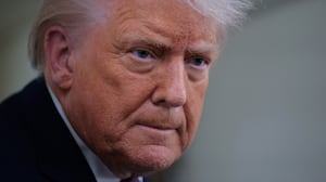 IN FLIGHT - JANUARY 22: U.S. President Donald Trump speaks to reporters on board Air Force One while flying in between Ireland and Washington as he returns from the World Economic Forum on January 22, 2026. Following a meeting with NATO Secretary General Mark Rutte, Trump announced a deal with European leaders on the semi-autonomous Danish territory of Greenland during the annual meeting of political and business leaders in Davos. (Photo by Chip Somodevilla/Getty Images)