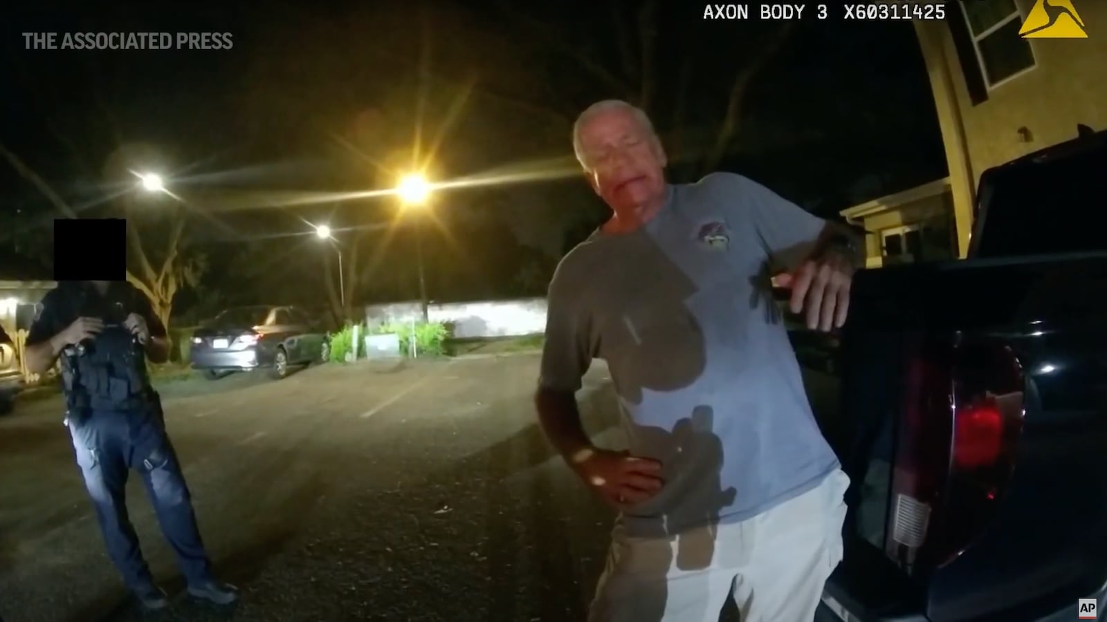 Bodycamera footage shows prosecutor Joseph Ruddy offering police his business card in an apparent attempt to leverage his position during his arrest in a DUI crash in Florida.