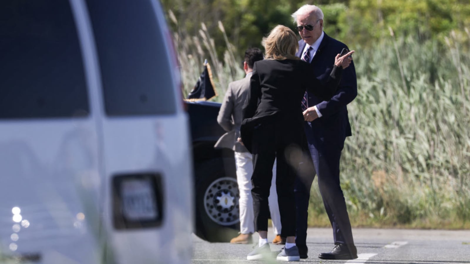 "US President Joe Biden speaks with First Lady Jill Biden after they exiting Marine One in Rehoboth Beach, Delaware Thursday.
