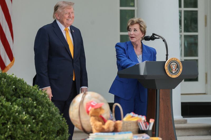 U.S. President Donald Trump stands next to U.S. Secretary of Education Linda McMahon, while hosting a back-to-school-themed event to highlight his administration's education policies, in the Rose Garden at the White House in Washington, D.C., U.S., August 24, 2026.