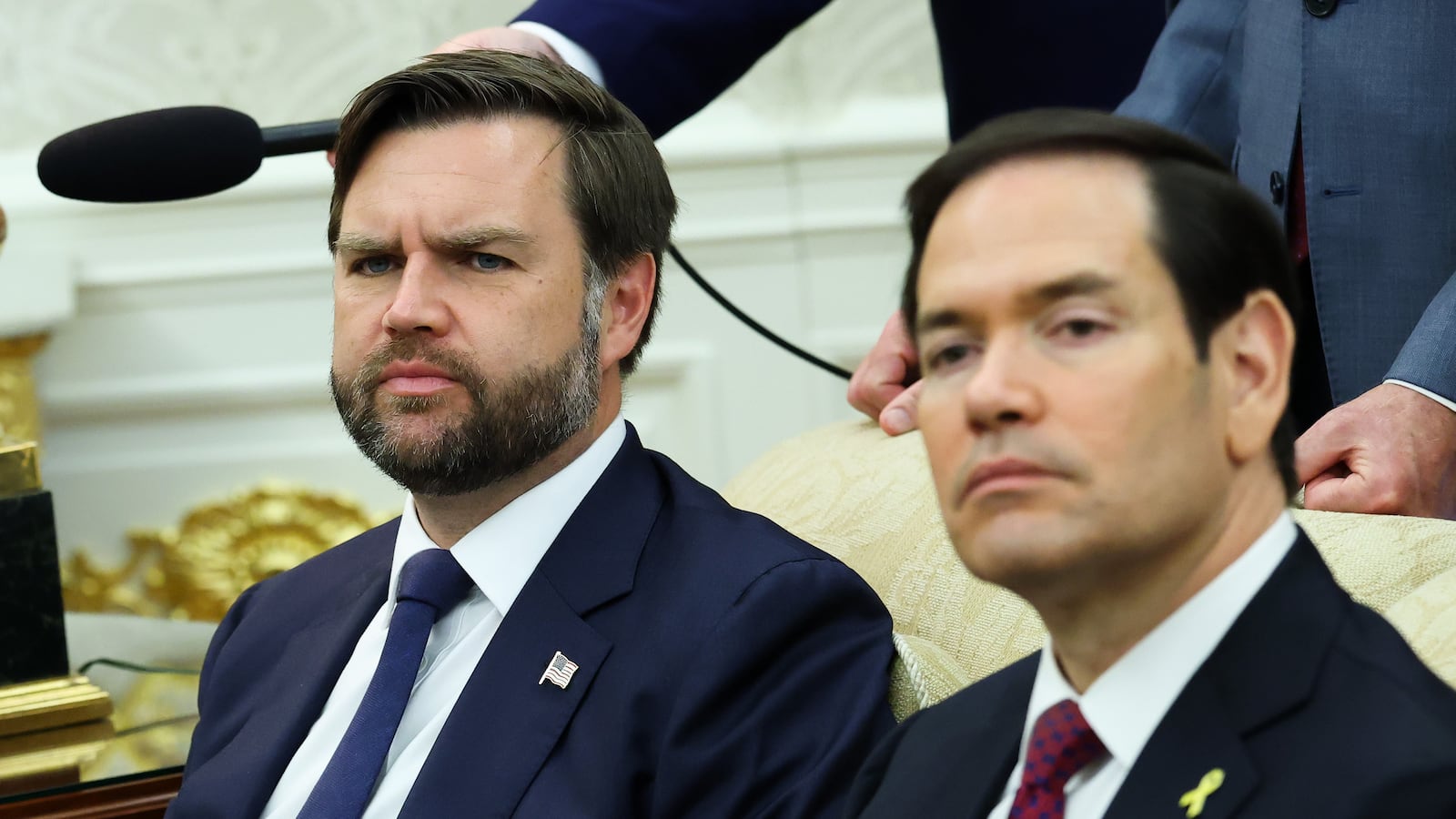 Vice President JD Vance and U.S. Secretary of State Marco Rubio look on during a meeting between U.S. President Donald Trump and Canadian Prime Minister Mark Carney in the Oval Office of the White House on October 07, 2025 in Washington, DC.