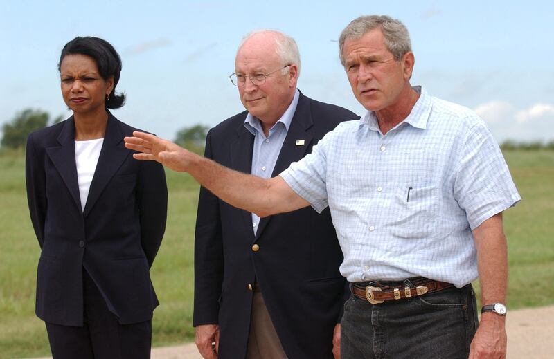 Cheney alongside Bush and Condoleezza Rice in 2004.