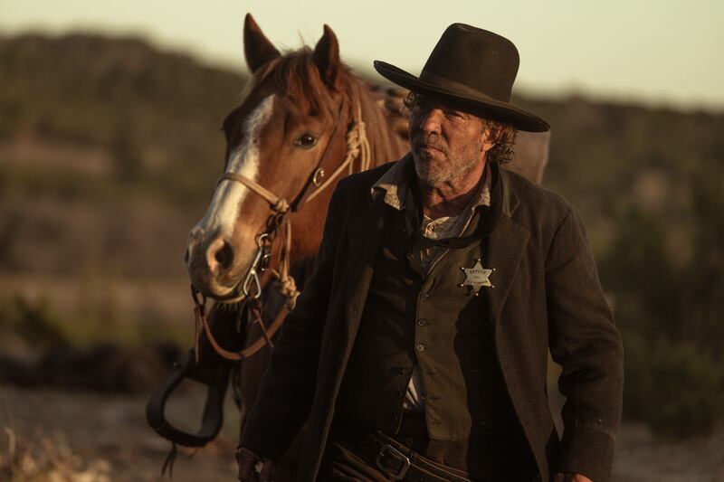 Dennis Quaid walks a horse in Lawmen: Bass Reeves