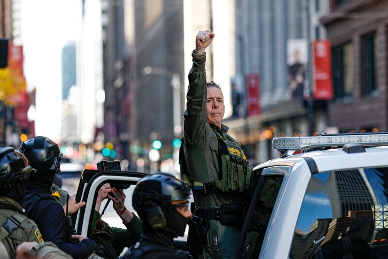 US Customs and Border Patrol Commander Gregory Bovino (C) leaves federal court at Dirksen Federal Building after his hearing in Chicago, Illinois,