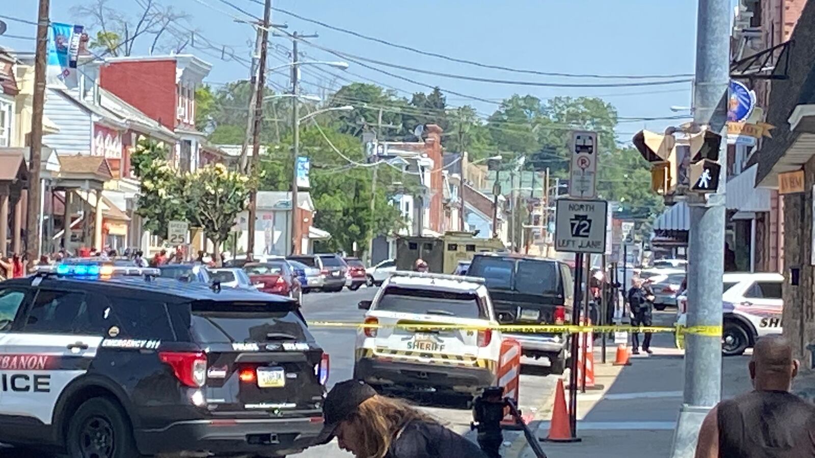 Cop cars and police tape near the scene of the shooting.