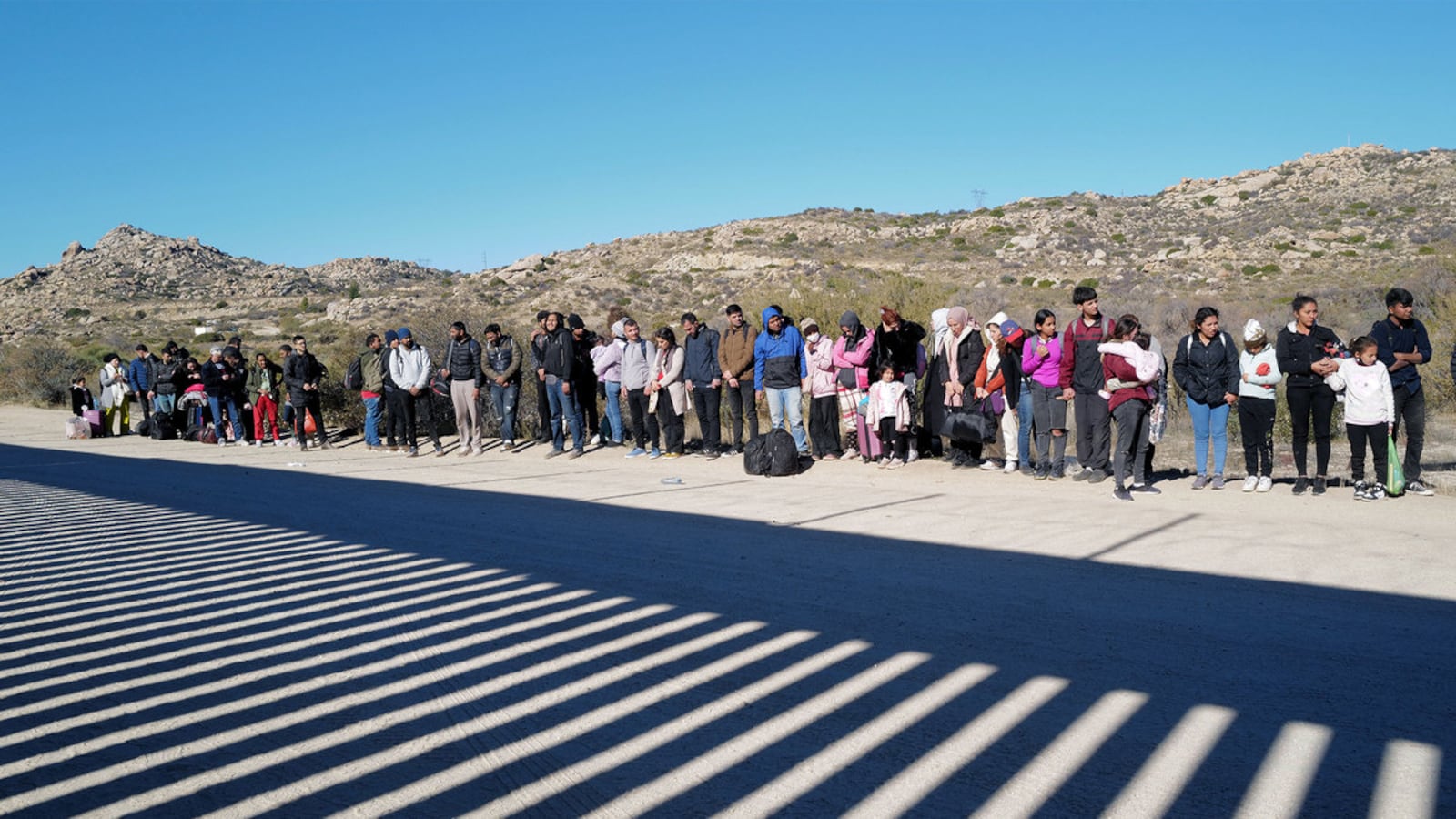 A picture of migrants at the U.S./Mexico border.