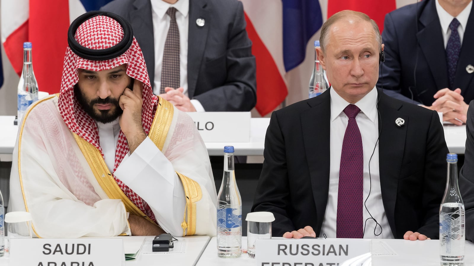Saudi Arabia's Crown Prince Mohammed bin Salman (L) sits beside Russia's President Vladimir Putin as they attend a meeting on the digital economy at the G20 Summit in Osaka on June 28, 2019. (Photo by Jacques Witt / POOL / AFP) (Photo credit should read JACQUES WITT/AFP via Getty Images)