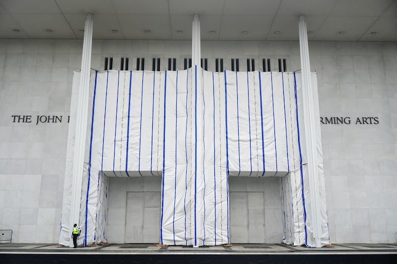 A tarp covers the facade of the John F. Kennedy Memorial Center for the Performing Arts, following a federal judge’s order to remove U.S. President Donald Trump's name from the institution, on the day comedian Bill Maher receives the Mark Twain Prize for American Humor at the Kennedy Center, in Washington, D.C., U.S., June 28, 2026.