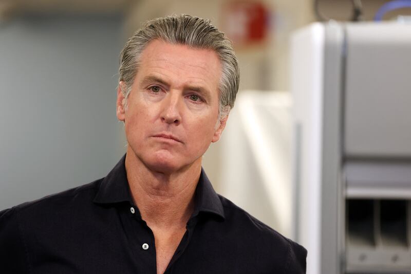 California Governor Gavin Newsom listens before speaking during a press conference announcing $11 insulin and prescription drugs with the CalRX program inside a Cedars-Sinai pharmacy in Los Angeles, California on October 16, 2025.