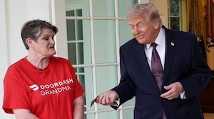 Trump tips Sharon Simmons after receiving a DoorDash delivery of McDonald's during the press conference. Photo by Win McNamee/Getty Images.
