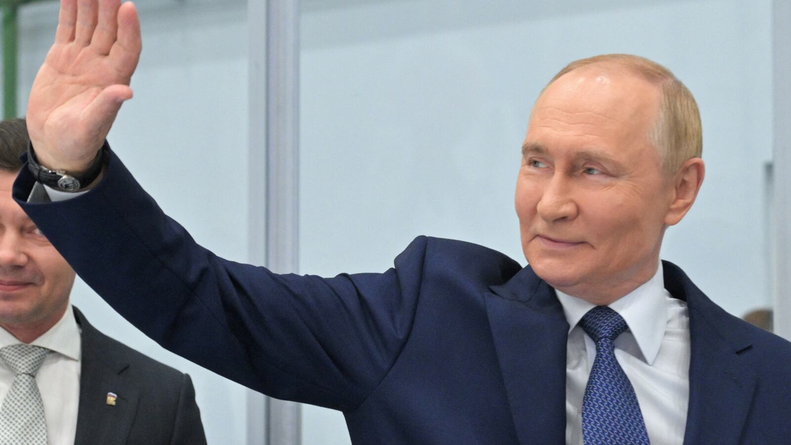 Russia's President Vladimir Putin waves as he visits a plant of Omega-Sea entreprise in the far eastern port city of Magadan on the Sea of Okhotsk on August 15, 2025, on his way to Alaska to meet with US' President.