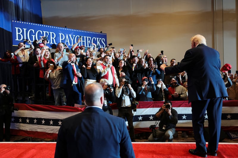 Donald Trump gestures at an event