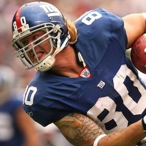 EAST RUTHERFORD, NJ - OCTOBER 7: Jeremy Shockey #80 of the New York Giants runs the ball against the New York Jets at Giants Stadium on October 7, 2007 in East Rutherford, New Jersey. (Photo by Nick Laham/Getty Images)