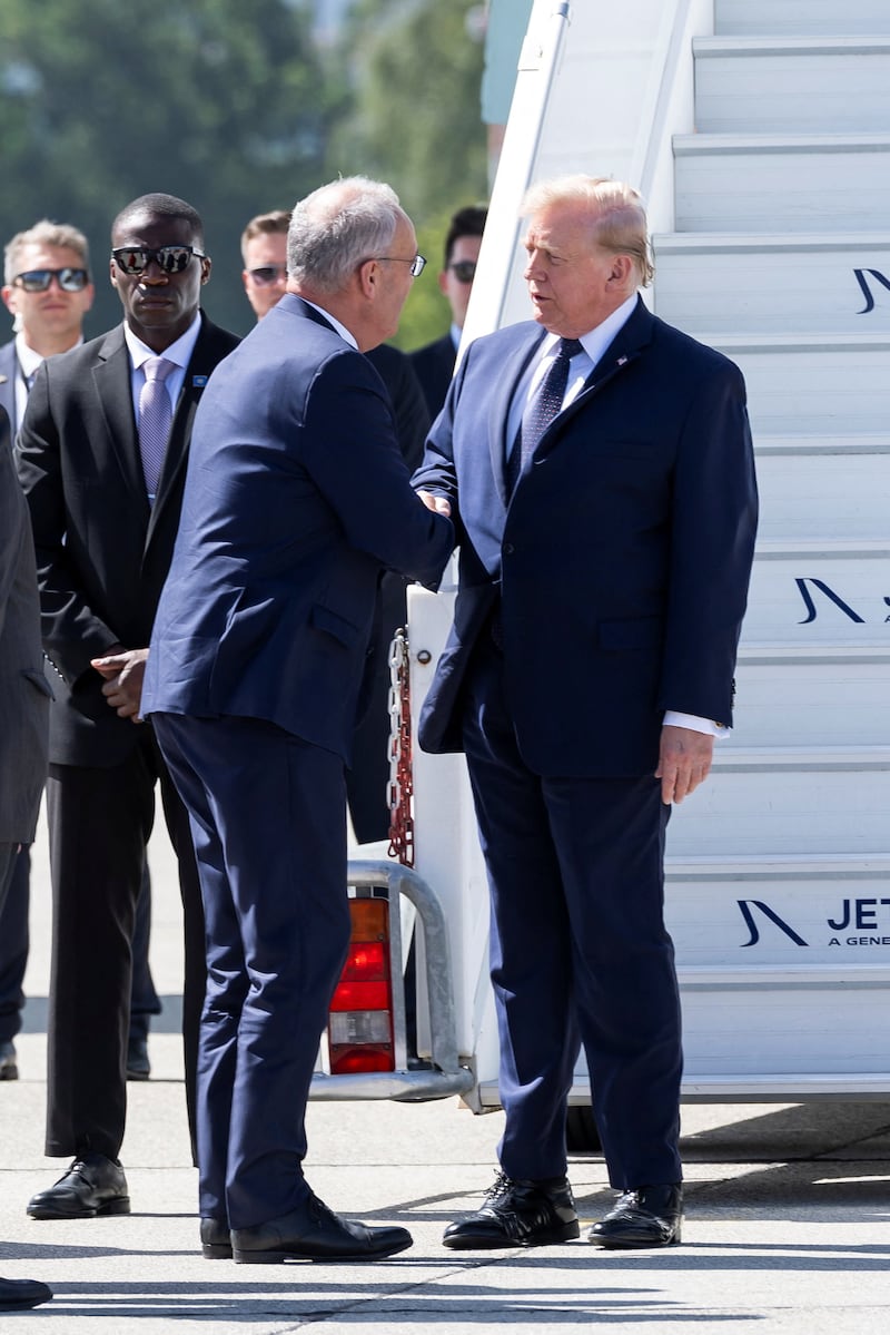 Swiss Federal President Guy Parmelin welcomes US President Donald Trump after Trump disembarked from Air Force One at Geneva Airport for France's G7 summit in Evian (France), in Geneva, Switzerland, Monday, June 15, 2026.  MARTIAL TREZZINI/Pool via REUTERS