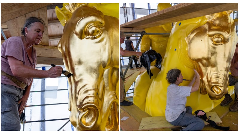 the statues are being painted gold.