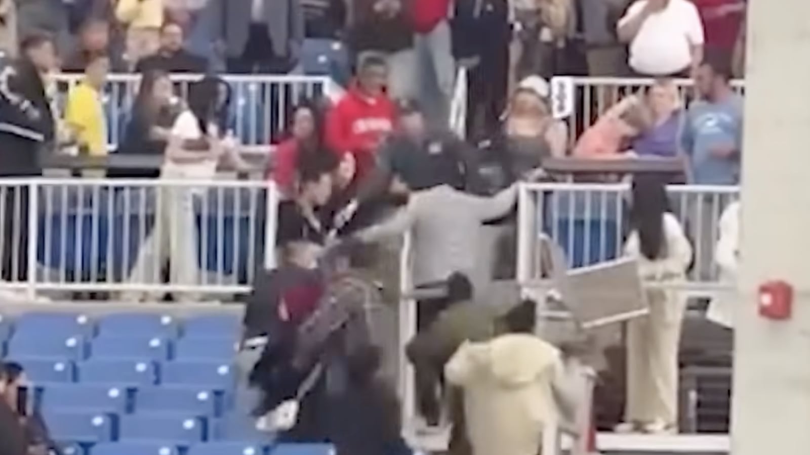A graduation ceremony in Connecticut briefly ground to a halt after a crowd fight led to arrests.