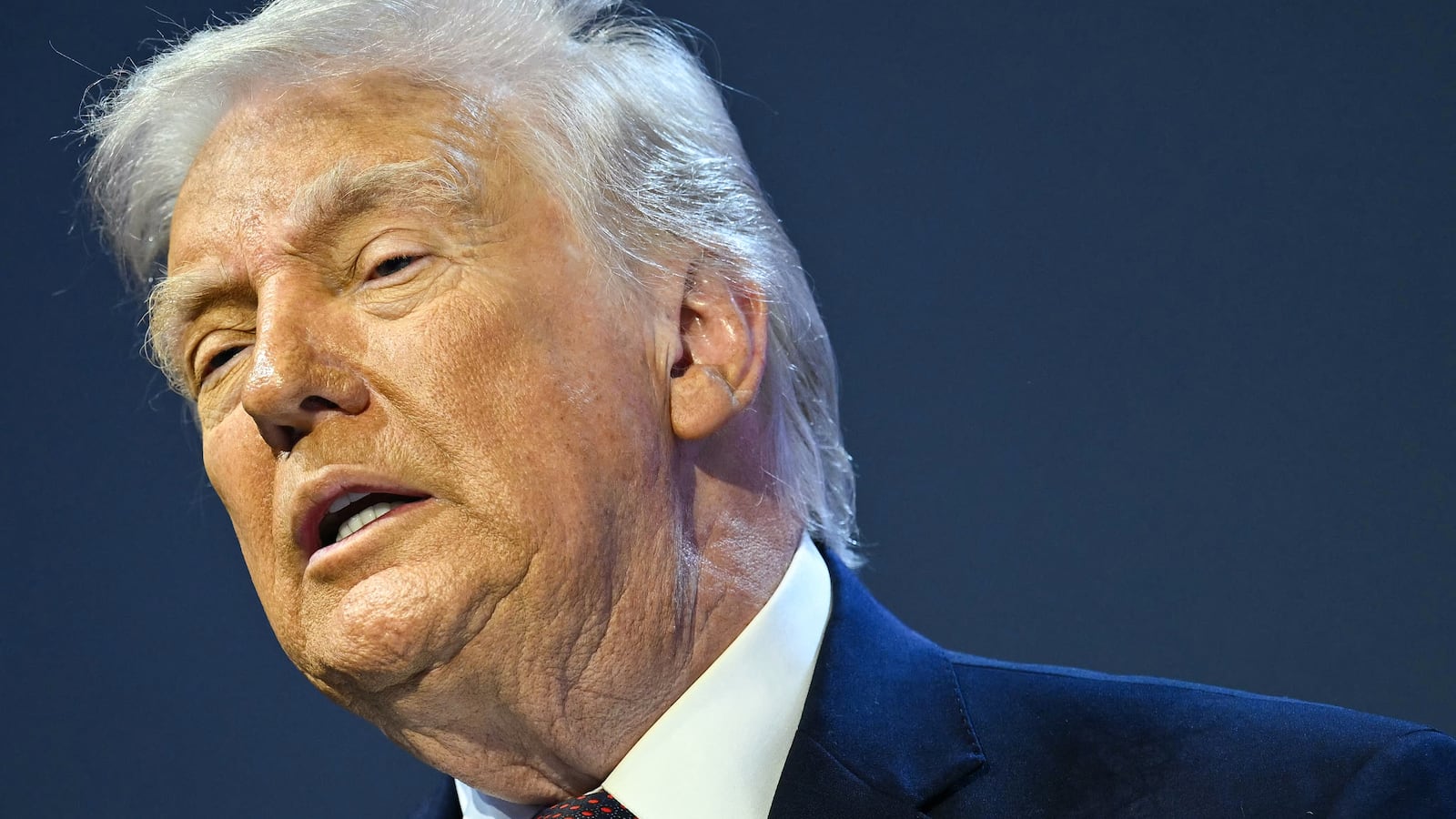 US President Donald Trump speaks at the "Board of Peace" meeting during the World Economic Forum (WEF) annual meeting in Davos on January 22, 2026. US President Donald Trump will show off his new "Board of Peace" at Davos on January 22, 2026 burnishing his claim to be a peacemaker a day after backing off his own threats against Greenland. Originally meant to oversee the rebuilding of Gaza after the war between Hamas and Israel, the board's charter does not limit its role to the Strip, and has sparked concerns that Trump wants it to rival the United Nations. (Photo by Mandel NGAN / AFP via Getty Images)