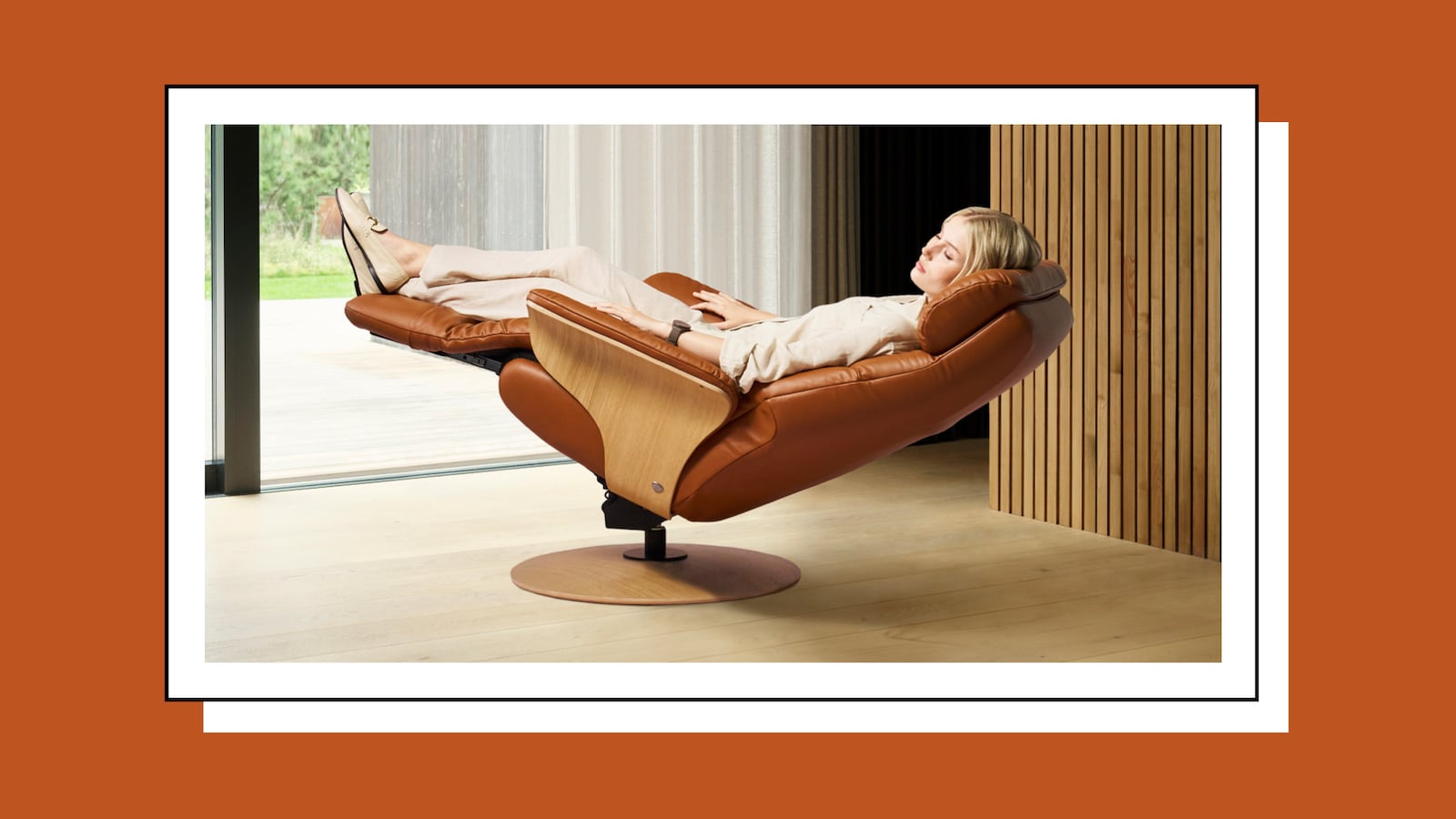 Woman in Stressless Adam Zero-Gravity Recliner in front of a window.
