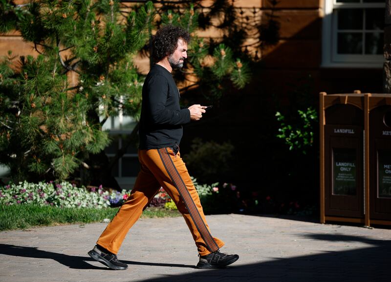 Wences Casares, the former CEO of Xapo, wore a 70s look with curly hair and orange pants.