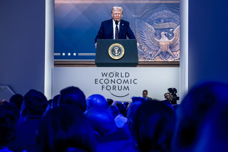 US President Donald Trump is seen on a giant screen during his address by video conference at the World Economic Forum (WEF) annual meeting in Davos on January 23, 2025. (Photo by FABRICE COFFRINI / AFP) (Photo by FABRICE COFFRINI/AFP via Getty Images)