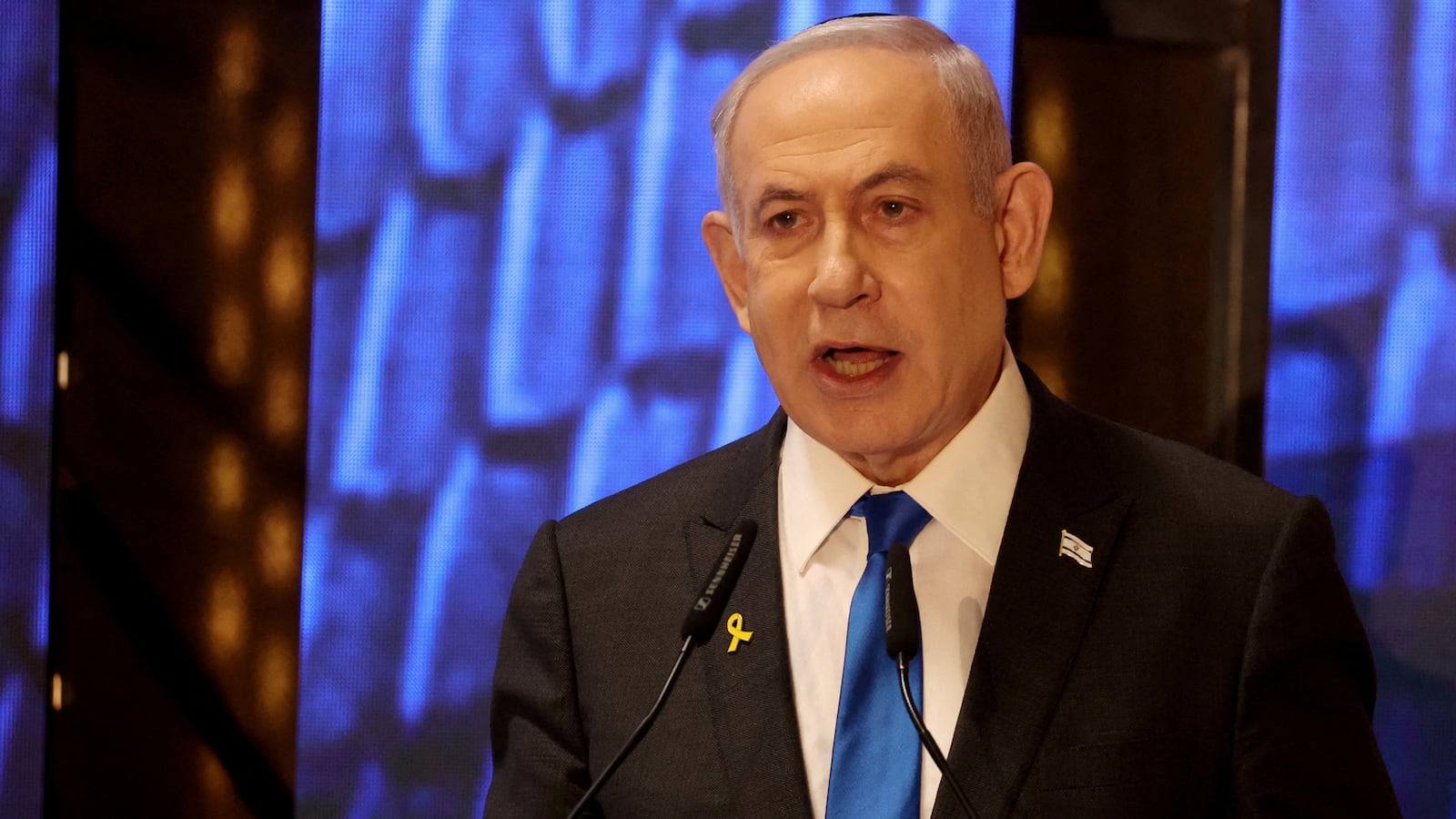 Israeli Prime Minister Benjamin Netanyahu speaks during a ceremony marking Memorial Day for fallen soldiers of Israel's wars and victims of attacks, at Jerusalem's Mount Herzl military cemetery, May 13, 2024.