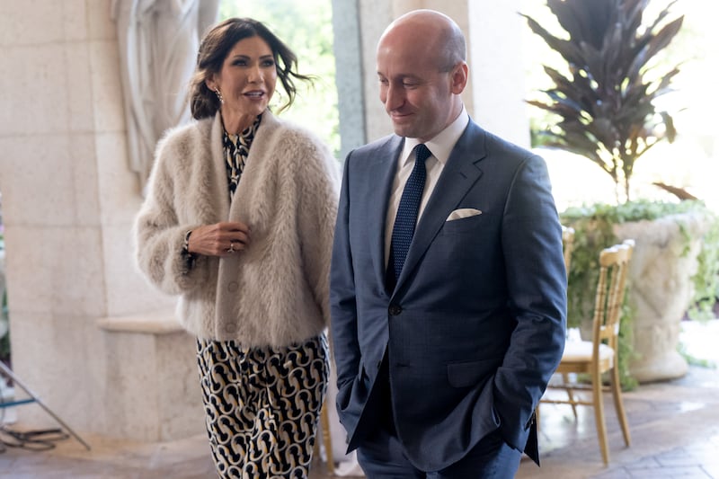 White House Deputy Chief of Staff for Policy Stephen Miller (R) and U.S. Secretary of Homeland Security Kristi Noem arrive to attend the wedding of Dan Scavino, White House Deputy Chief of Staff, and Erin Elmore.