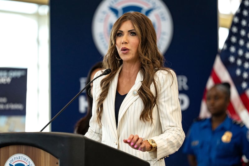 ARLINGTON, VA - JULY 8: U.S. Secretary of Homeland Security Kristi Noem speaks during a news conference at Ronald Reagan Washington National Airport on July 8, 2025 in Arlington, Virginia. For the first time in nearly two decades, the TSA is easing its shoe removal rule introduced five years after a 2001 shoe-bombing attempt by allowing some travelers to keep their shoes on at security checkpoints.  (Photo by Kent Nishimura/Getty Images)