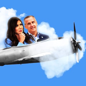 Corey Lewandowski and Kristi Noem in a propeller plane going through heart clouds