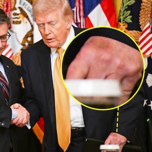 US President Donald Trump shakes hands with US Speaker of the House Mike Johnson (L), Republican from Louisiana as he arrives during a lunch with the Kennedy Center Board Members in the East Room of the White House on March 16, 2026 in Washington, DC. (Photo by Annabelle GORDON / AFP via Getty Images)