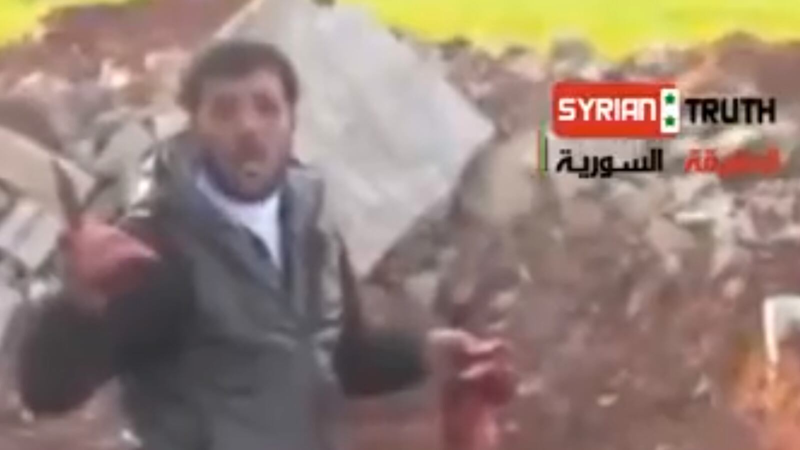 cheats/2013/05/14/syrian-in-video-mutilating-corpse-speaks/130514-alhamad-cheat_yixyqx