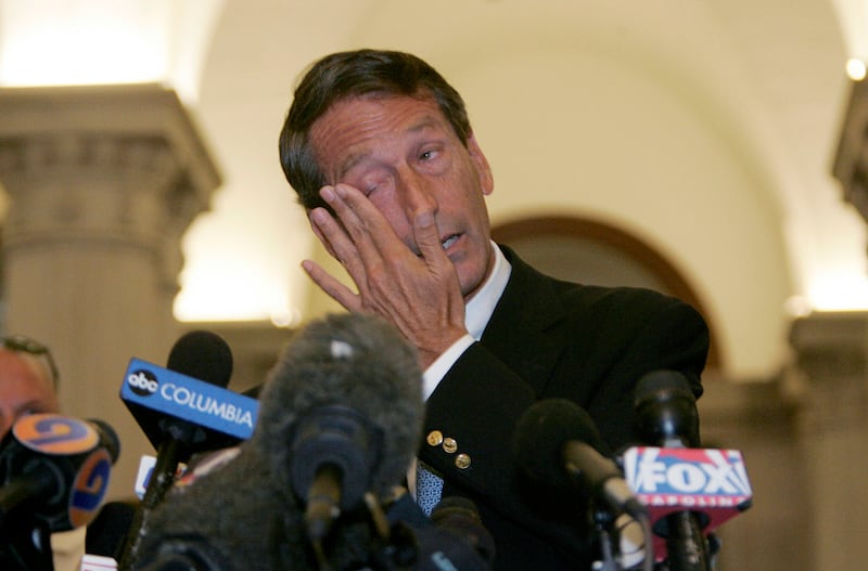 South Carolina Governor Mark Sanford wipes his eyes as he speaks to the media about his trip to Buenos Aires, Argentina and admits to an extramarital affair at the State House in Columbia, South Carolina, June 24, 2009.
