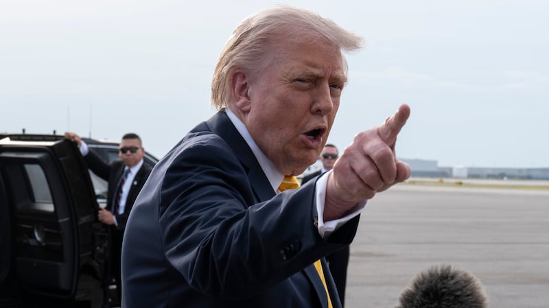 President Donald Trump speaks to journalists before boarding Air Force One at Palm Beach International Airport on May 2, 2026 in Palm Beach, Florida.