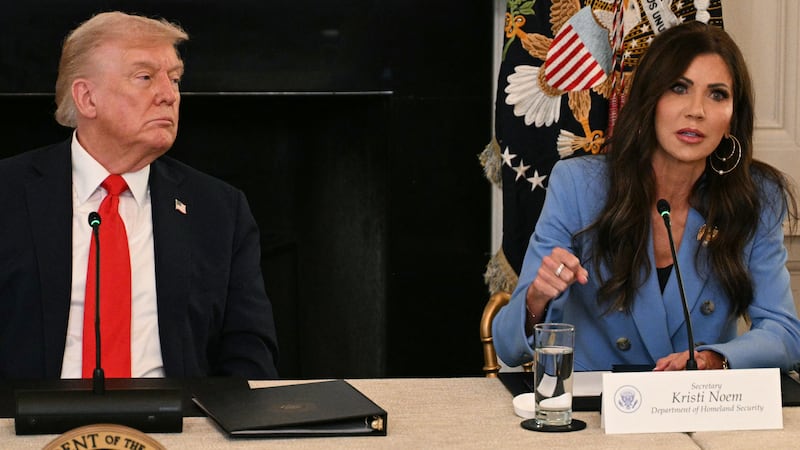President Donald Trump with then Homeland Security Secretary Kristi Noem speak during a roundtable on October 8, 2025.