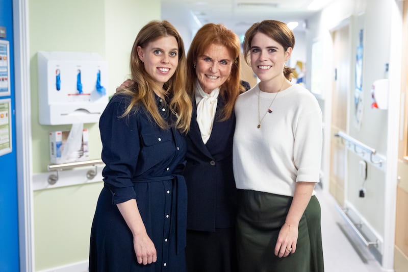 Sarah, Duchess of York with her daughters Princess Beatrice and Princess Eugenie during a visit to the Teenage Cancer Trust unit at University College Hospital, London. Picture date: Wednesday April 23, 2025. (Photo by Aaron Chown/PA Images via Getty Images)