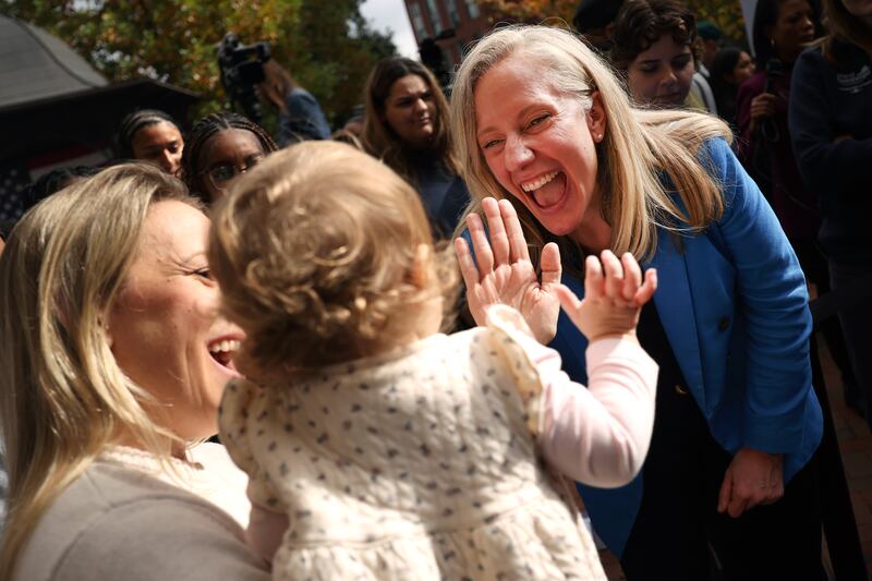 Virginia Democratic gubernatorial nominee former Rep. Abigail Spanberger greets Brittany Whitley and her daughter Amelia during a rally at Virginia Commonwealth University on November 3, 2025 in Richmond, Virginia.