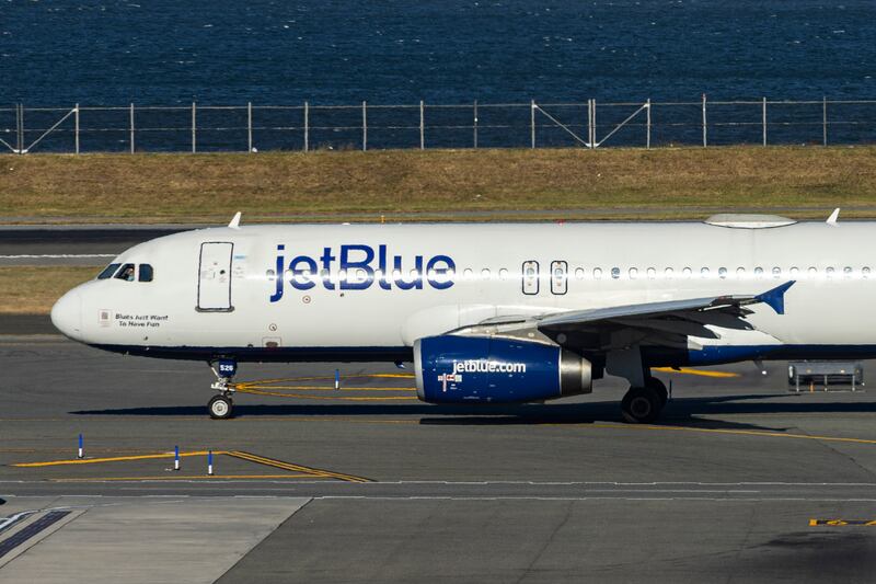JetBlue Airbus A320-200 passenger aircraft spotted taxiing in LaGuardia airport LGA in New York City. The A320 airplane has the registration tail number N526JL, the name Blues Jsut Want to Have Fun and is powered by 2x IAE jet engines. Jet Blue Airways Corporation is a major airline in the United States with headquarters in Long Island City, Queens, NYC operating domestic and international network routes with a fleet of 286 planes. New York, USA on November 12, 2024 (Photo by Nicolas Economou/NurPhoto via Getty Images)