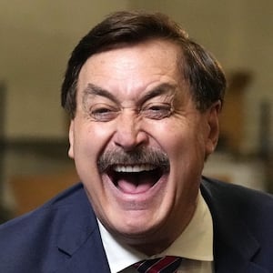 My Pillow founder and CEO Mike Lindell laughs as he greets reporters while announcing his run for Governor of Minnesota to a camera streaming to LindellTV Thursday, Dec. 11, 2025 at his company's warehouse in Shakopee, Minn.  ] ANTHONY SOUFFLE • anthony.souffle@startribune.com