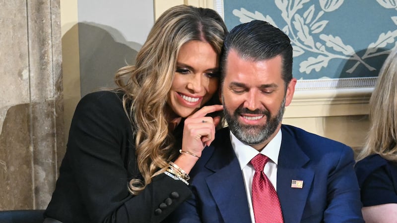 Donald Trump Jr. (R) sits with Bettina Anderson ahead of US President Donald Trump's address to a joint session of Congress in the House Chamber of the US Capitol in Washington, DC, on March 4, 2025.