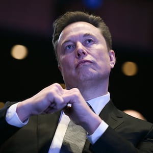 Elon Musk looks on as US President Donald Trump speaks at the US-Saudi Investment Forum at the John F. Kennedy Center for the Performing Arts in Washington, DC on November 19, 2025. (Photo by Brendan SMIALOWSKI / AFP) (Photo by BRENDAN SMIALOWSKI/AFP via Getty Images)