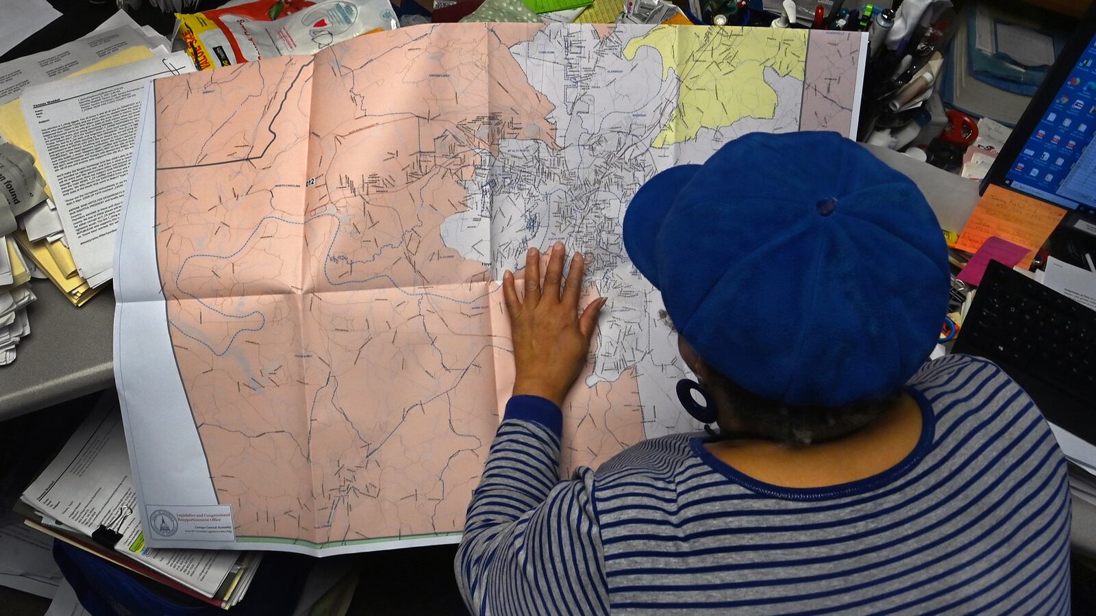 Vanessa Waddell sits at her office desk and double checks some redistricting maps.