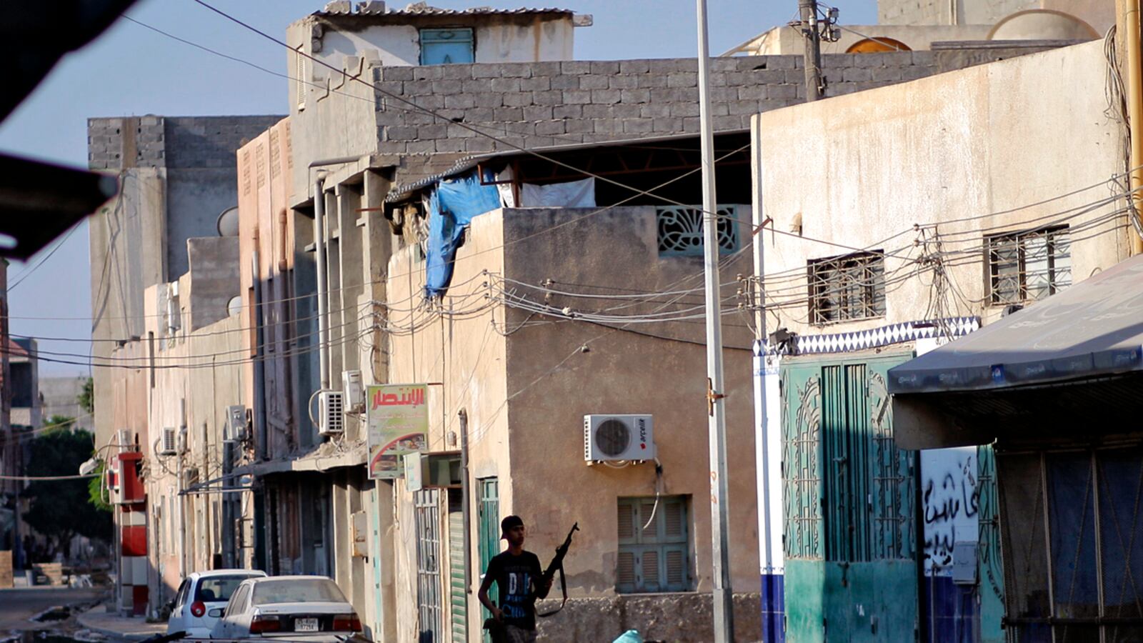 articles/2011/08/23/libya-news-rebels-delay-announcing-victory-until-gaddafi-is-caught/libya-rebel-patrol-kossov_lpihae