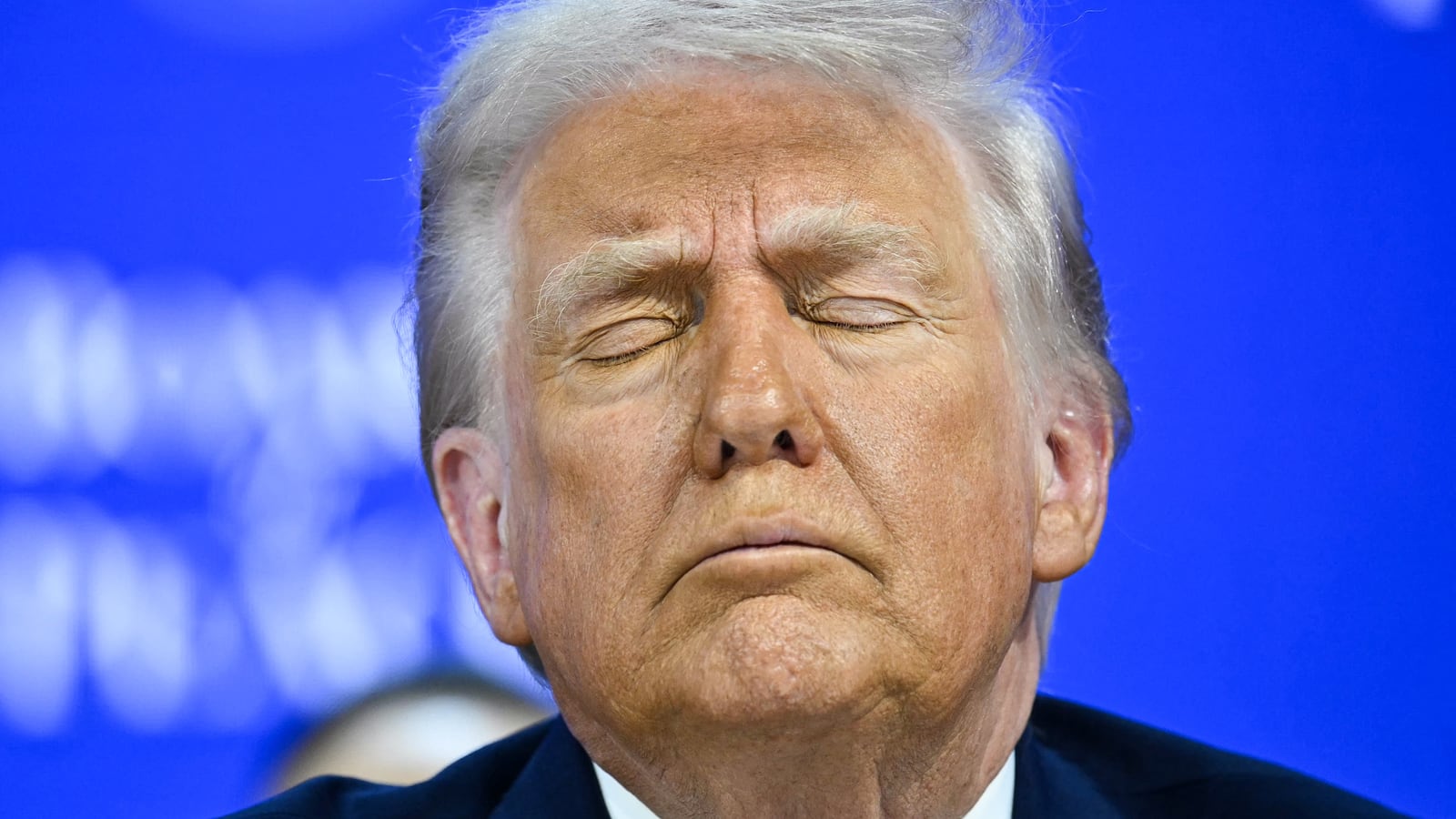 President Donald Trump reacts at the "Board of Peace" meeting during the World Economic Forum (WEF) annual meeting in Davos on January 22, 2026.