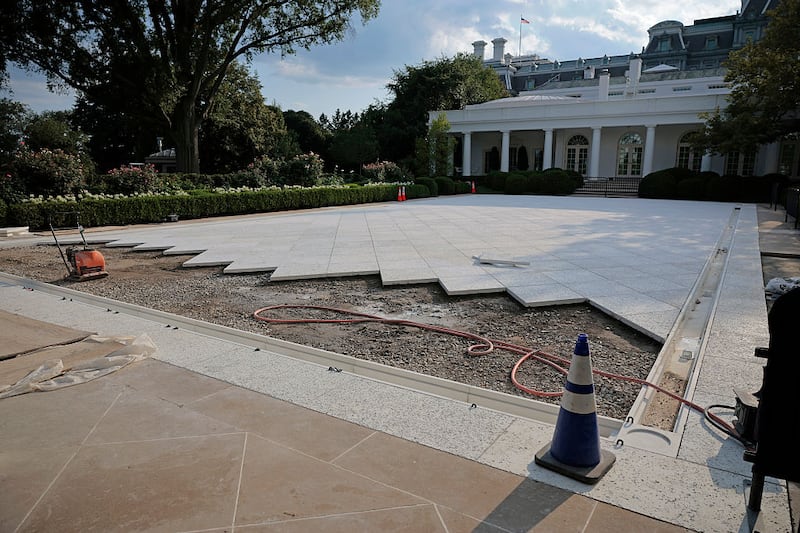 WASHINGTON, DC - JULY 23: Work continues in paving over the White House Rose Garden lawn on July 23, 2025 in Washington, DC. Trump today signed executive orders related to his AI "Action Plan" intended to promote U.S. dominance of the technology. (Photo by Chip Somodevilla/Getty Images)