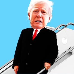 Donald Trump with a scared face going down plane stairs