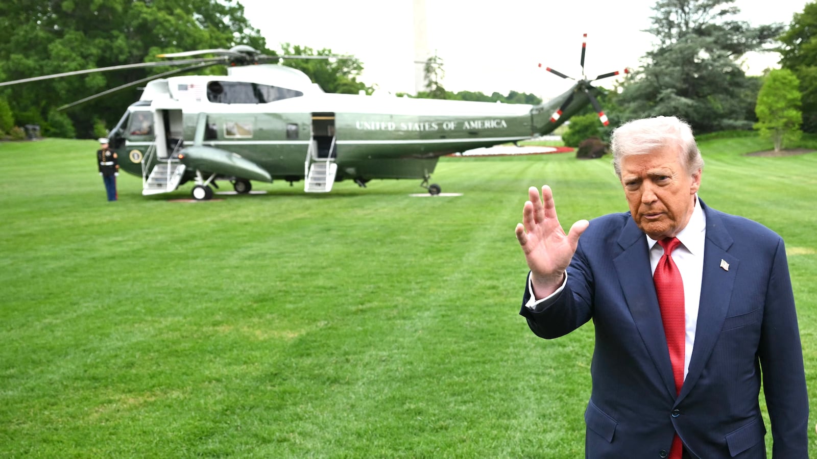 US President Donald Trump speaks to journalists as he makes his way to board Marine One