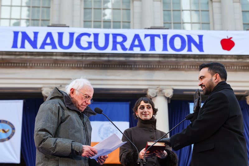 Sen. Bernie Sanders (I-VT) swears in Zohran Mamdani as New York City mayor as Mamdani's wife Rama Duwaji looks on at City Hall Thursday January 1, 2026 in New York.