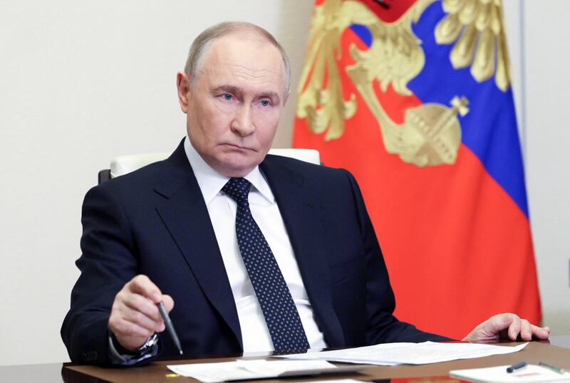 President Vladimir Putin chairs a government meeting via a videoconference on June 4, 2025, according to a photograph distributed by the Russian state agency Sputnik, the same day he spoke with President Trump by phone.