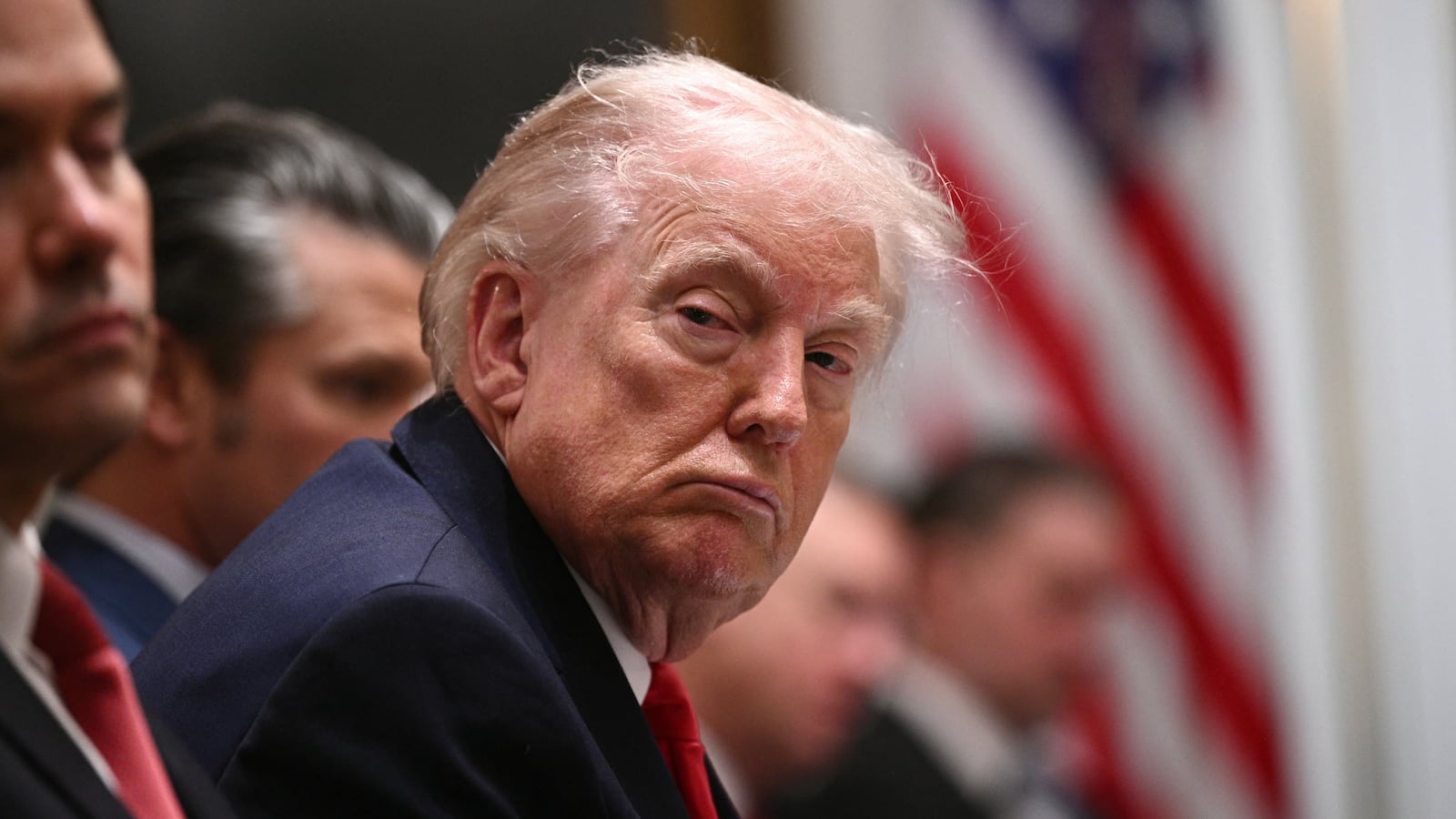 President Donald Trump was seated between Secretary of State Marco Rubio, left, and Defense Secretary Pete Hegseth, right, during Thursday’s meeting.