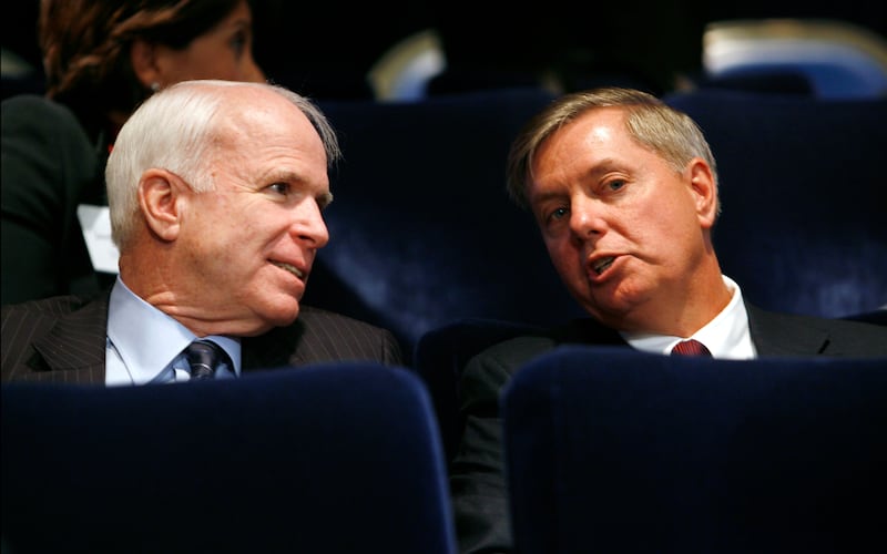 U.S. Republican Senators John McCain (L) and Lindsey Graham talk during the Fiscal Responsibility Summit at the White House in Washington February 23, 2009.       REUTERS/Kevin Lamarque   (UNITED STATES)